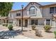 Charming townhome with a stucco facade, red tile roof, and well-maintained landscaping at 1961 N Hartford St # 1055, Chandler, AZ 85225