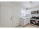 Modern kitchen features stainless steel appliances, white cabinetry and lots of light at 1961 N Hartford St # 1055, Chandler, AZ 85225