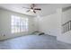 Light-filled living room with fan and easy access to the entrance at 1961 N Hartford St # 1055, Chandler, AZ 85225