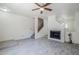 Inviting living room featuring a fireplace, stairs, and updated flooring at 1961 N Hartford St # 1055, Chandler, AZ 85225