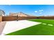 Large grassy backyard with a basketball court and block fence at 20451 E Via De Colina --, Queen Creek, AZ 85142