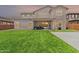Expansive backyard featuring lush green grass, covered patio, and inviting outdoor space for relaxation and entertainment at 20451 E Via De Colina --, Queen Creek, AZ 85142
