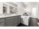Elegant bathroom with dual vanity, soaking tub, and hexagon tile floors at 20451 E Via De Colina --, Queen Creek, AZ 85142