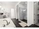 Elegant bathroom with walk-in shower, soaking tub, and black hexagon tile floors at 20451 E Via De Colina --, Queen Creek, AZ 85142