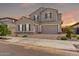 Charming two-story home featuring a three car garage, manicured landscaping, and inviting curb appeal at 20451 E Via De Colina --, Queen Creek, AZ 85142