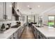 Bright kitchen featuring gray cabinets, stainless steel appliances and a long quartz countertop at 20451 E Via De Colina --, Queen Creek, AZ 85142