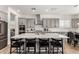 Bright kitchen featuring gray cabinets, stainless steel appliances and a large island with seating at 20451 E Via De Colina --, Queen Creek, AZ 85142