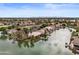 Scenic aerial view of lakefront homes showcasing beautiful landscaping and serene waterways at 2128 E Clipper Ln, Gilbert, AZ 85234