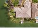 Overhead view of home featuring new tile roof, pristine lawn and private dock on the lake at 2128 E Clipper Ln, Gilbert, AZ 85234