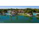 Stunning aerial view of a community clubhouse featuring pool, lake access, and dining at 2128 E Clipper Ln, Gilbert, AZ 85234