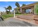 Charming backyard with waterfront access, a private boat dock, and outdoor seating on the covered patio at 2128 E Clipper Ln, Gilbert, AZ 85234