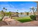 Backyard with lake access, lush grass and landscaping at 2128 E Clipper Ln, Gilbert, AZ 85234