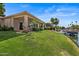 Spacious backyard with manicured lawn, waterfront access, and lush landscaping, perfect for outdoor enjoyment at 2128 E Clipper Ln, Gilbert, AZ 85234