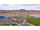 Aerial view of a well-maintained community park with playground, walking paths, and sports facilities at 2128 E Clipper Ln, Gilbert, AZ 85234
