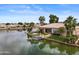 Beautiful waterfront home with well-manicured lawn and private boat dock, perfect for lakefront living at 2128 E Clipper Ln, Gilbert, AZ 85234