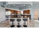 Gourmet kitchen features dark granite countertops, stainless steel appliances, and island seating at 2128 E Clipper Ln, Gilbert, AZ 85234