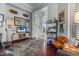 Comfortable living room with wood floors, built-in shelves, and natural light for relaxed living at 2128 E Clipper Ln, Gilbert, AZ 85234
