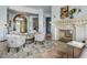Inviting living area with a fireplace, stylish seating, and an open layout ideal for entertaining at 2128 E Clipper Ln, Gilbert, AZ 85234