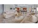 Comfortable open-concept living area with barstool seating at a dark granite countertop at 2128 E Clipper Ln, Gilbert, AZ 85234