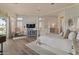 Serene main bedroom suite boasts a four-poster bed, ceiling fan, water view, and plenty of natural light at 2128 E Clipper Ln, Gilbert, AZ 85234