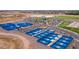 Aerial view of multiple blue pickleball courts with shade structures in a well-planned recreational area at 2128 E Clipper Ln, Gilbert, AZ 85234