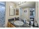 Well-lit bathroom with a spacious vanity and ample mirror space at 2228 N 52 St # 213, Phoenix, AZ 85008