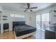 Bright bedroom featuring wood floors and private balcony access at 2228 N 52 St # 213, Phoenix, AZ 85008