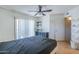 Cozy bedroom featuring balcony access and bright light at 2228 N 52 St # 213, Phoenix, AZ 85008