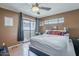 Cozy bedroom features private balcony access and natural light at 2228 N 52 St # 213, Phoenix, AZ 85008