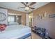 Comfortable bedroom featuring wood floors and mirrored closet doors at 2228 N 52 St # 213, Phoenix, AZ 85008