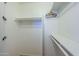 Walk-in closet featuring white walls and shelving, offering plenty of storage for clothing and accessories at 2228 N 52 St # 213, Phoenix, AZ 85008