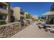 Outdoor common area features grilling stations, picnic tables, and a swimming pool for resident enjoyment at 2228 N 52 St # 213, Phoenix, AZ 85008