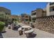 Community picnic area featuring stone tables and benches, plus a grilling station, for outdoor gatherings and resident enjoyment at 2228 N 52 St # 213, Phoenix, AZ 85008