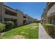 The exterior showcases balconies and meticulously landscaped lawn area at 2228 N 52 St # 213, Phoenix, AZ 85008