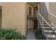 Exterior building with well-maintained landscaping, showcasing accessibility via staircases and secure entry doors at 2228 N 52 St # 213, Phoenix, AZ 85008