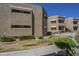Exterior view of complex featuring neutral color, stucco, and well-maintained landscaping at 2228 N 52 St # 213, Phoenix, AZ 85008