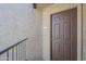 Inviting entryway with a solid wood door and clear unit number for easy identification of the property at 2228 N 52 St # 213, Phoenix, AZ 85008