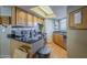 Kitchen features stainless appliances, granite counters, wood cabinets, and ample storage for cooking essentials at 2228 N 52 St # 213, Phoenix, AZ 85008