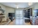 Well-lit living room with access to a balcony, featuring sleek flooring and modern decor for relaxed living at 2228 N 52 St # 213, Phoenix, AZ 85008
