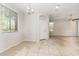 Dining room with tile flooring, natural light, white walls, and a view to the front entrance at 2475 E Vermont Dr, Gilbert, AZ 85295