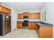 Functional kitchen featuring stainless steel appliances, granite counters, light wood cabinets, and a window at 2475 E Vermont Dr, Gilbert, AZ 85295