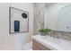 Stylish powder room featuring unique wall details, modern art, and a sleek vanity at 25564 N 119Th St, Scottsdale, AZ 85255