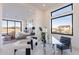 Bright bedroom featuring large windows, a cozy seating area, and modern decor at 25564 N 119Th St, Scottsdale, AZ 85255