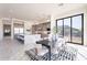 Dining area features modern table set and large window view at 25564 N 119Th St, Scottsdale, AZ 85255