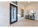 Welcoming entryway with modern decor, light wood floors, and a stylish console table at 25564 N 119Th St, Scottsdale, AZ 85255