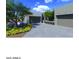 Modern home with desert landscaping, featuring a spacious three-car garage and contemporary architecture at 25564 N 119Th St, Scottsdale, AZ 85255