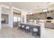 Open kitchen with a large island with seating, stainless steel appliances and lots of storage at 25564 N 119Th St, Scottsdale, AZ 85255