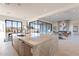 Bright open-concept kitchen features a large island with seating and seamless access to the living room at 25564 N 119Th St, Scottsdale, AZ 85255
