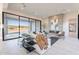 Living room boasts cozy seating area with fireplace and backyard view at 25564 N 119Th St, Scottsdale, AZ 85255