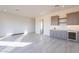 Bright open living space featuring a modern wet bar with custom cabinets and a wine cooler at 25564 N 119Th St, Scottsdale, AZ 85255